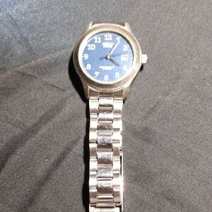 A silver watch with a blue face